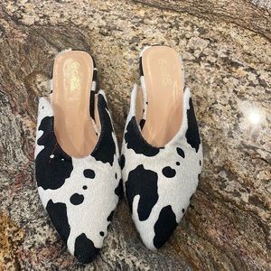 Cow print faux fur mules